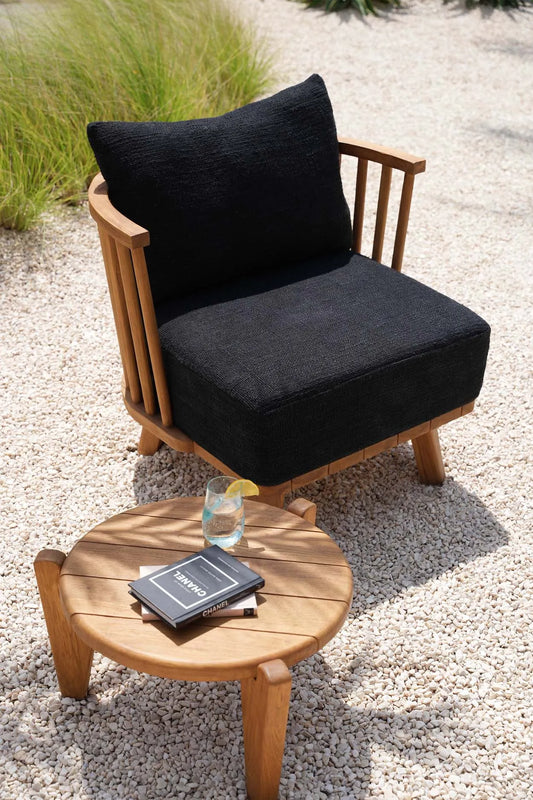 Natural outdoor coffee table on coastal hotel terrace - boho hospitality design 2025